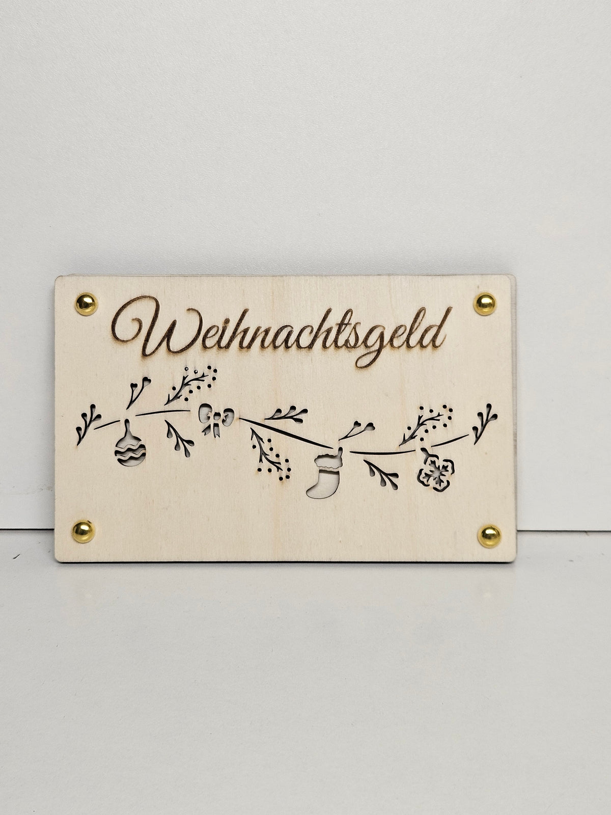 Geldgeschenk aus Holz mit Schriftzug Weihnachtsgeld, weihnachtlichen Motiven und goldfarbenen Details